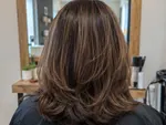 Example work photo: a layered brunette cut, from behind