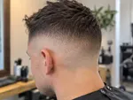 Example work photo: a short skin fade, from the side