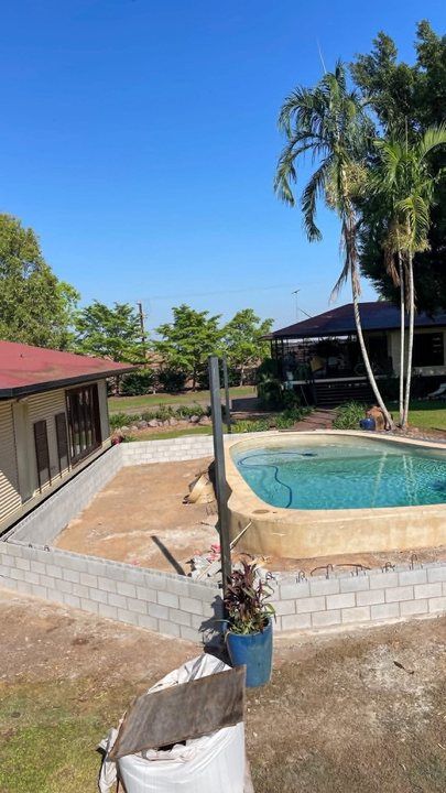 A poolside wall by Ash Huskisson Masonry
