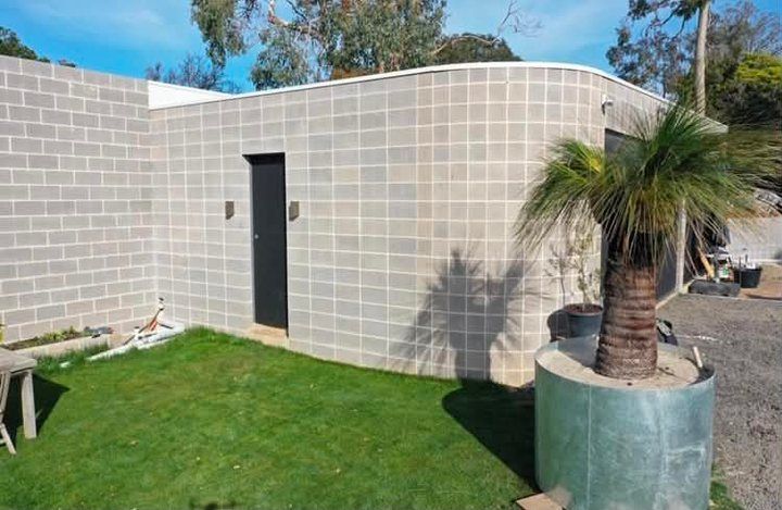 A curved block wall by Ash Huskisson Masonry