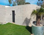 The new Zuccoli page, with a curved block wall
