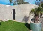 A curved block retaining wall built by Ash Huskisson Masonry