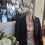 A navy blazer on a dress form